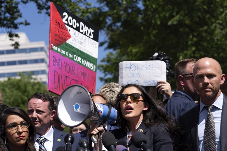 Rep. Anna Paulina Luna, R-Fla., accompanied by other congress members speaks to the media after they toured the George Washington University students encampment as they protest over the Israel-Hamas war on Wednesday, May 1, 2024, in Washington. (AP Photo/Jose Luis Magana)